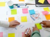 A team working on a project using sticky notes.