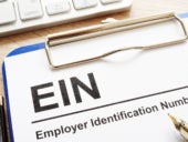 Employer Identification Number (EIN) on a clipboard.