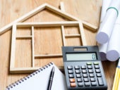 Construction valuation of home renovation abstract with calculator and plans.