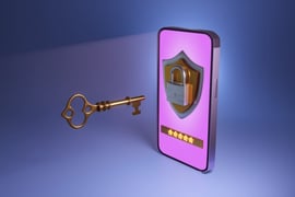 Mobile phone showing a shield, a password input field and a lock which is being opened by a gold key.
