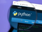 Python website on highlight under a magnifying glass.