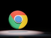 Google Chrome logo spotlighted on black background.