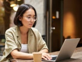 Woman using a laptop.