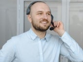 Stock photo of a happy call center rep.