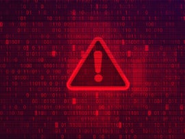 Red warning symbol on abstract red background with binary code numbers.