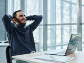 A frustrated employee on his laptop.