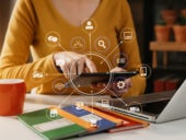 Social media and Marketing virtual icons screen of business women typing keyboard with laptop computer and tablet at office.