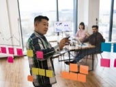 Brainstorming with sticky notes.
