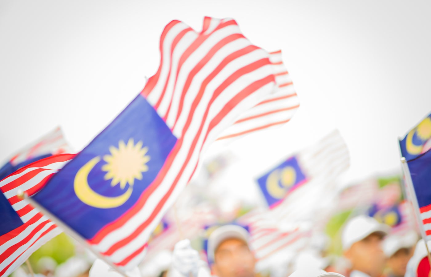 Blurry Malaysia flags waving on Independence Day.