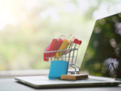 E-commerce shopping online concept,shopping bag in cart on laptop