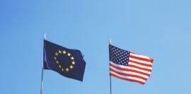 Flags of Europe and USA next to each other.
