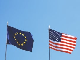 Flags of Europe and USA next to each other.