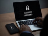 Laptop and mobile phone with locked encryption.