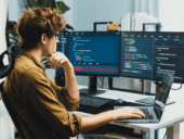 Man infront of monitors