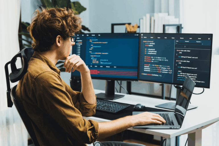 Man infront of monitors