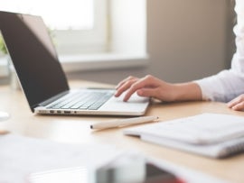Person working on a laptop.