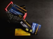 Credit cards on the cart and floor to pay for the product.