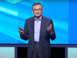 Intel CEO Lip-Bu Tan speaking at a tech conference