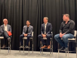 Stramski 2nd from right speaking at Pure Accelerate 2025.