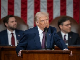 Donald Trump standing in a podium.