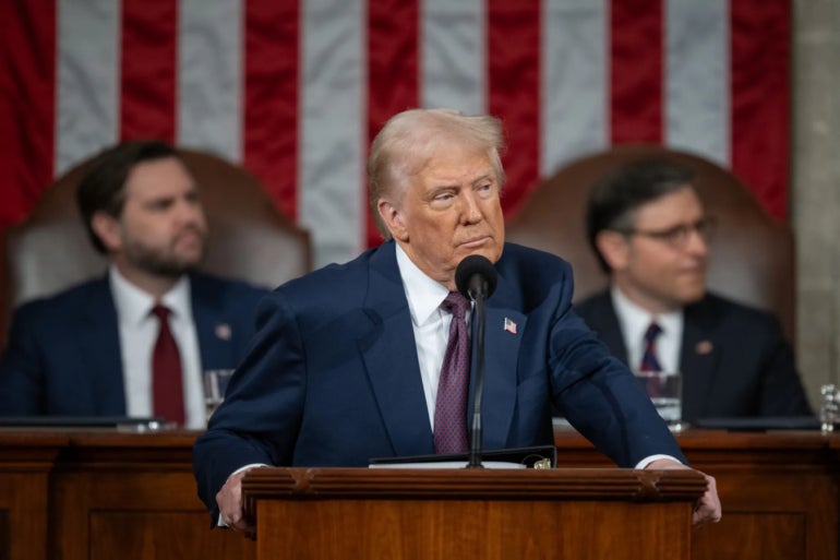 Donald Trump standing in a podium.