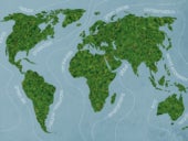 Green world. Close-up image of moss textured world map at the blue background