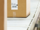 Goods On Conveyor Belt In Distribution Warehouse