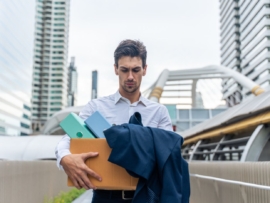 Caucasian businessman walking outdoor after unemployment from company.
