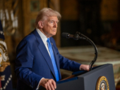 US President Donald J. Trump standing in a podium.