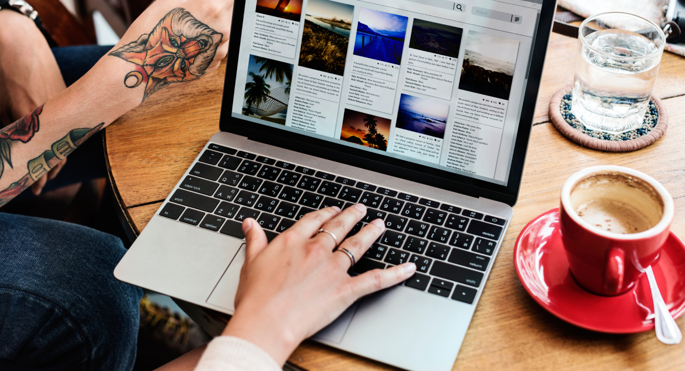 A man browsing through the internet with his laptop.