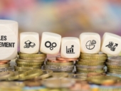 A set of cubes placed on top of coins with "Sales Enablement" written on it.