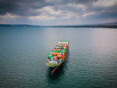 A loaded container ship in the sea, aerial view, concept of international trade and shipping