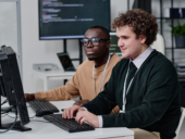 IT specialists writing codes for new software.