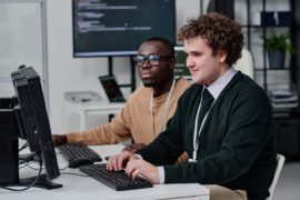 IT specialists writing codes for new software.