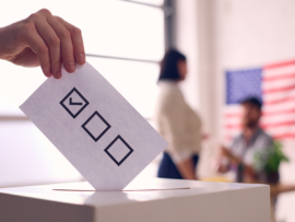 Person Casting Ballot in Election