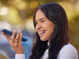 A happy woman having a phone call.