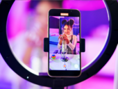 Phone screen, girl and ring light for live streaming, sound recording and microphone for online live stream