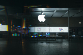 Outside view of an Apple Store seen at night.