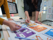 two women brainstorming and planning on a project.