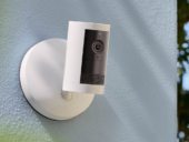 Ring security camera mounted on exterior wall.