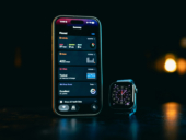 Smartphone and smartwatch displaying apps on-screen data.