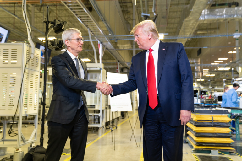 Tim Cook and President Donald Trump shaking hands.