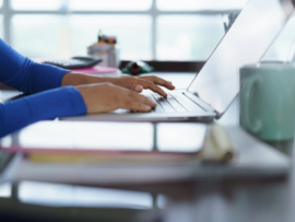 Woman working on her laptop in the office.