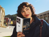 Motorola razr fold held by a woman.