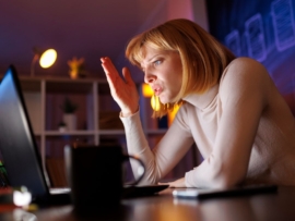 A woman in front of a laptop