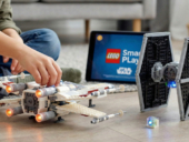 A kid playing with a lego set.