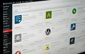 WordPress dashboard 'Add Plugins' page showing popular extensions like Classic Editor, Akismet Anti-Spam, and Gutenberg.