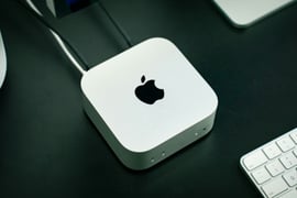 closeup of an apple mac mini and keyboard